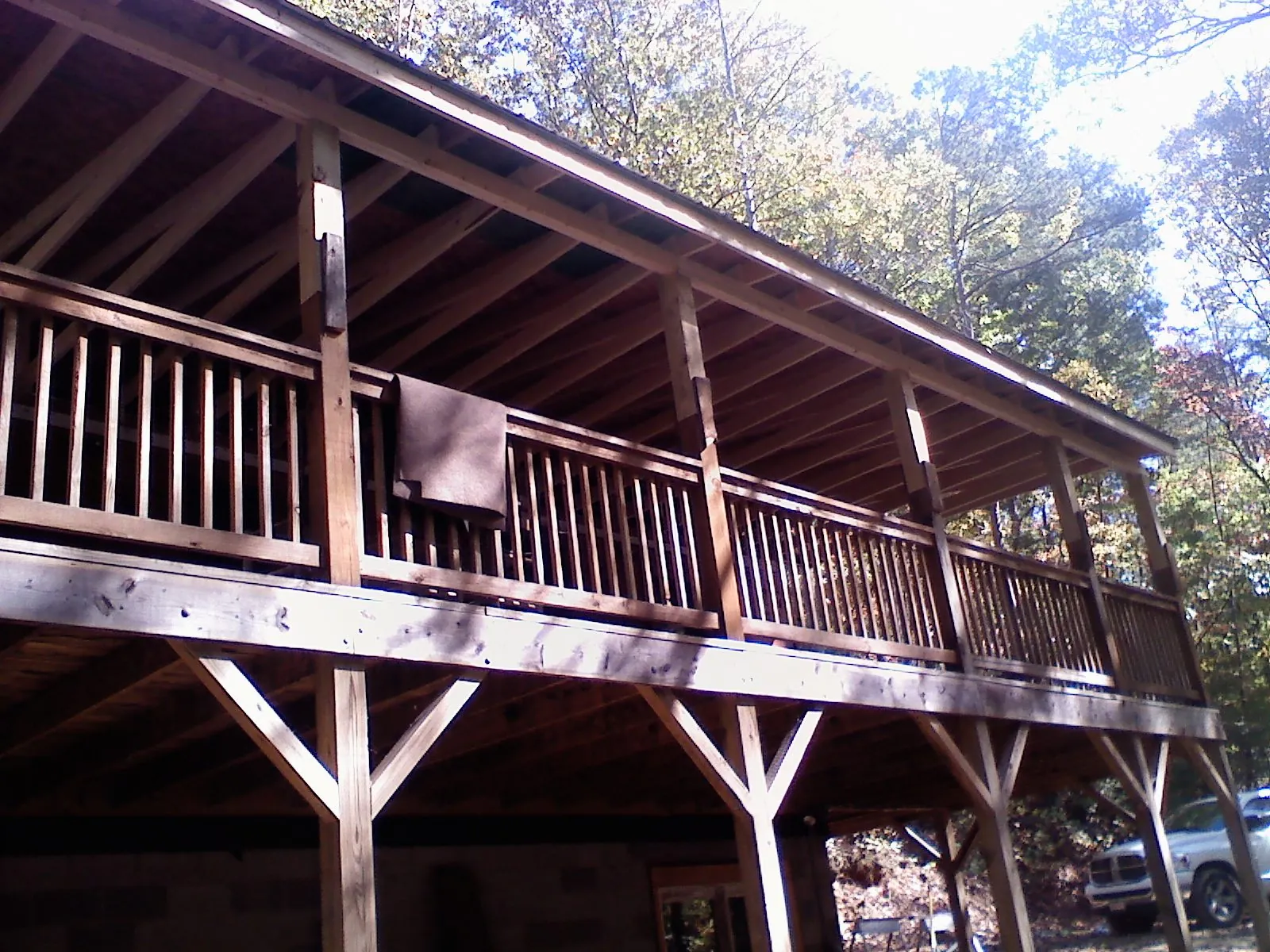 Timber framing under a new elevated porch and deck — Roof Leak Repair in Melvin Village by Roofing Brothers